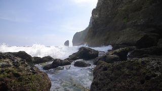 Waves crashing over the cliffs