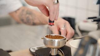 Stirring Elixir: Close-Up of Coffee Swirling in Motion
