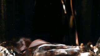 Liquid Symphony: Mesmerizing Close-Up of Water Pouring
