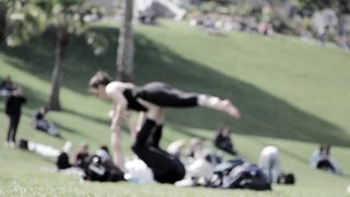 Harmony in Nature: Couple's Yoga Amidst the Serenity of the Park