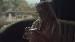 Coffee Moments: A Woman's Serene Cafe Experience