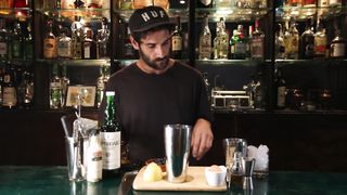 Mixology Magic: Bartender Crafting a Signature Cocktail