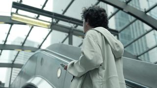 Ascending Ambition: A Young Man's Journey Up the Escalator