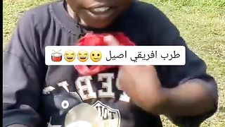 A young african talent plays a bottle of water
