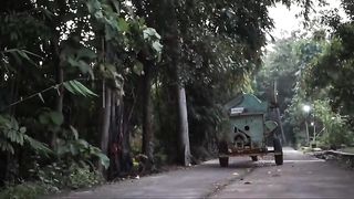 a grandmother hoists water from a well