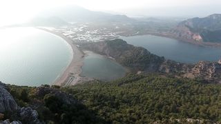 Nature's Symphony: A Breathtaking Aerial Vista of Ocean, Lakes, and Mountains