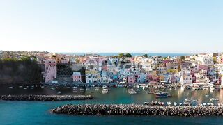 Vibrant Summer Vibes: Exploring Procida's Iconic Colored Houses Nestled Near the Ocean in an Italian Vacation Escape
