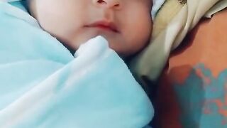 Cute baby laying on bed