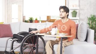 Empowerment Through Taste: Teenager in Wheelchair Enjoys Mealtime