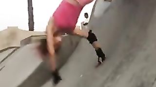 The girl performs cool tricks on roller skates
