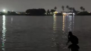 A person farming on the river