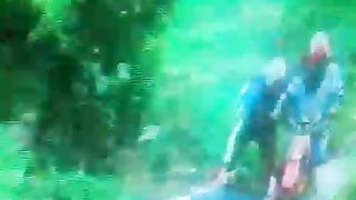 riding a motorbike in the middle of the forest on rough terrain