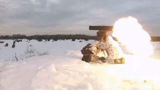 Russian and Belarusian troops fire rocket launchers in winter conditions