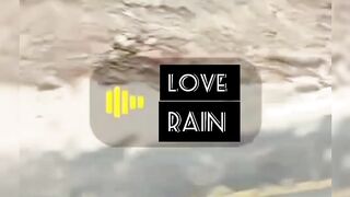 A Beautiful View of The Rain Falling On Thہ Mountain .