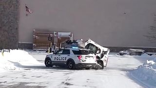 Man in skid-steer goes on rampage smashing police vehicle