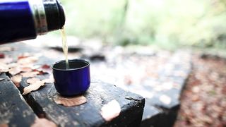 Pouring tea at the cabin in the woods