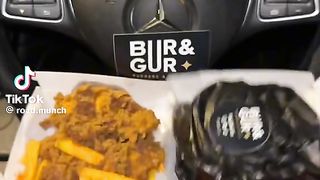 Eating burgers and fries in my Mercedes