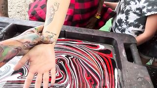 Red White and Black Body Marbling Dip by BLVisuals @ Faster Horses Festival.
