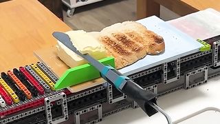Automatic butter spreader contraption.