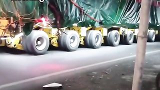 giant truck carrying transformer
