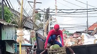 the janitor is wearing a Spiderman costume