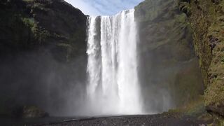 Skógafoss: Majestic Cascade in Iceland's Rugged Landscape"