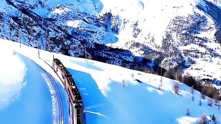 A RAILWAY JOURNEY IN THE SNOW COVERED MOUNTAINS