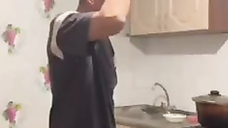 A lover of strong alcoholic beverages tries to break a bottle with his head