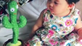 Cute baby and talking cactus