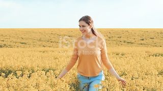 Happy Woman Girl Walks Flowering Field Rape Touches Yellow Flowers Enjoy Day Stock Video