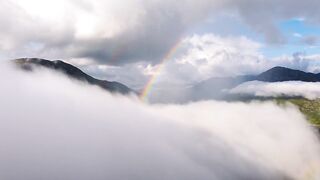 Chasing Dreams: Flying Through the Clouds Towards a Rainbow"