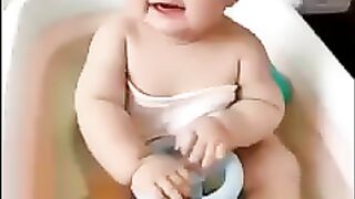 Bathing a baby in Srilanka