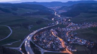 Evening brings a spectacle of vehicle lights as the streets and highways are lit up with headlights, taillights and street lamps.