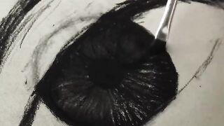 Eye drawing using charcoal