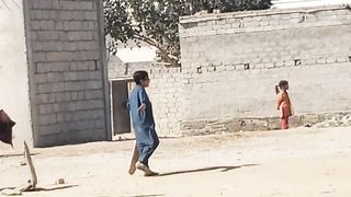 Kids playing cricket