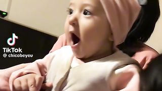 In the Embrace of Love: A Child's Playful Bonds with 'Baba' and 'Mama'"