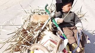 Cute kid on the goat????