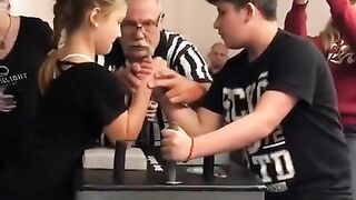 A girl at an arm wrestling tournament