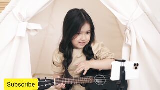 Girl Playing Music in Front of Phone