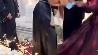 The boy played with his friend by pretending to be a girl