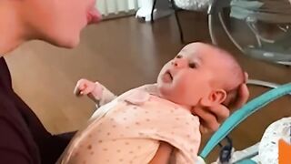 "Heartwarming Moment: Newborn Baby Mimics Dad's Voice and Makes Him Giggle - A Bond Like No Other"