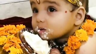 Cute baby eating makhan
