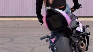 A Biker Girl Doing Stunts