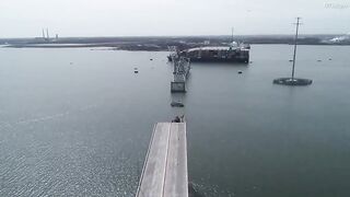 Aerial shows Francis Scott Key Bridge and cargo ship aftermath
