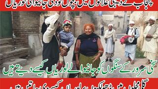People giving Lori to children in groups in Punjab.
