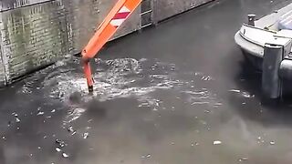 Cleaning the canals of Amsterdam.