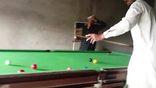 Playing snooker