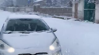 Snow falls in night