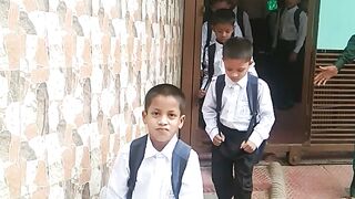 Leaving for school wearing school dress