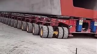 Amazing large modern truck carrying huge concrete gider bridge